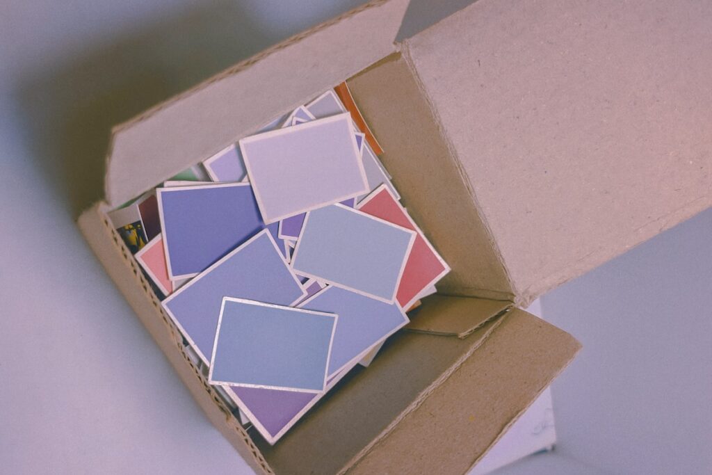 white and red square on brown cardboard box