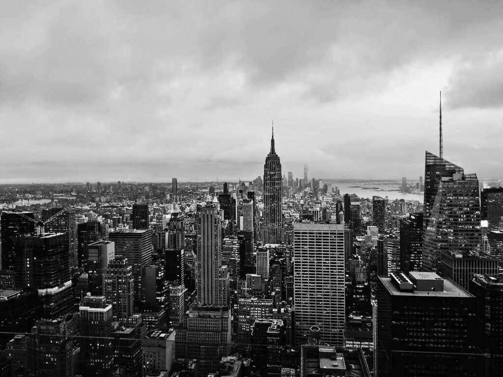 grayscale photo of city buildings